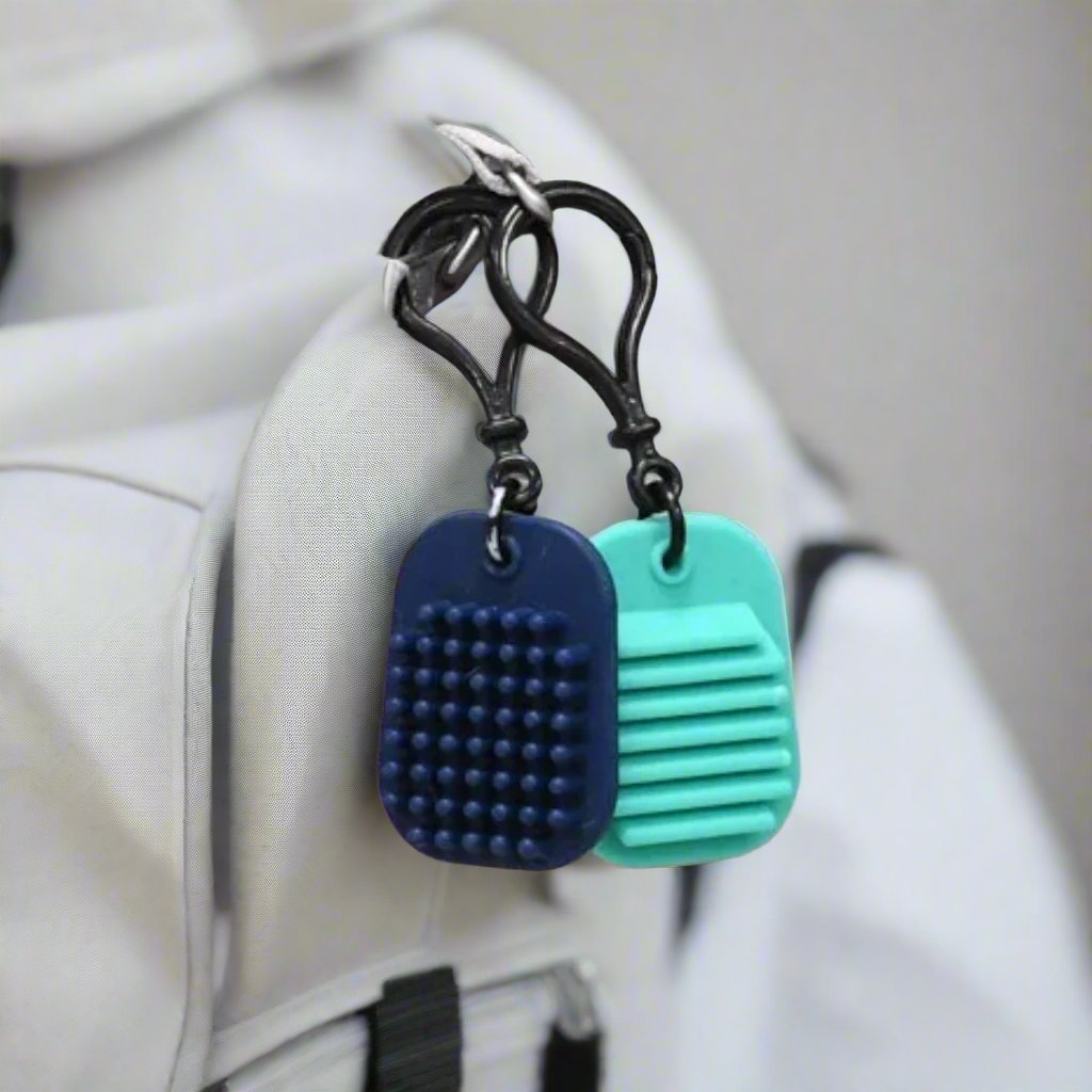 Calming sensory fidget clips on a bag
