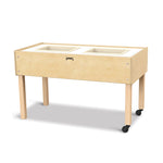 Wooden sensory table with white trays on a white background