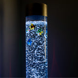 Bubble tube up close with plastic fish floating