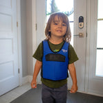 Child wearing blue and black weighted vest